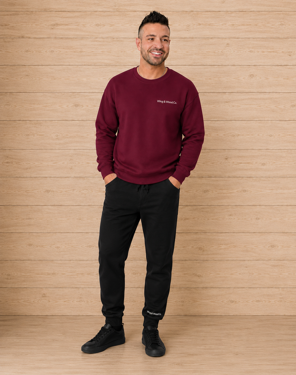 image of a male model wearing "wing & wood co." black sweatpants
