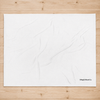 A large white fabric backdrop sheet with subtle wrinkles, laid flat on a light-colored wooden plank background. The brand name 'Wing & Wood Co.