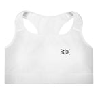 White racerback sports bra with a small black geometric logo on the left chest, shown against a plain white background.