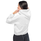 Person wearing a white wind breaker hoodie on a white background