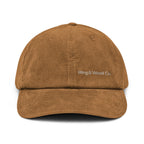 A brown corduroy baseball cap with 'Wing & Wood Co.' embroidered in white on the front, shown against a plain white background.