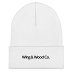 A white ribbed knit beanie hat with a folded cuff, featuring the text 'Wing & Wood Co.' printed in black on the front cuff, set against a plain white background.