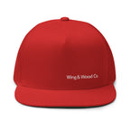 A bright red structured baseball cap with a flat brim, featuring the white embroidered text 'Wing & Wood Co.' on the front, shown against a plain white background.
