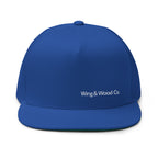 A royal blue structured baseball cap with 'Wing & Wood Co.' embroidered in white on the front, set against a plain white background.
