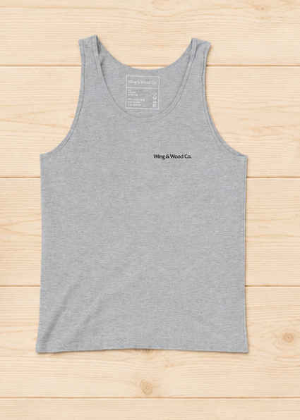 A heather gray sleeveless tank top with a small black 'Wing & Wood Co.' logo on the left chest, laid flat on a light wood plank background.