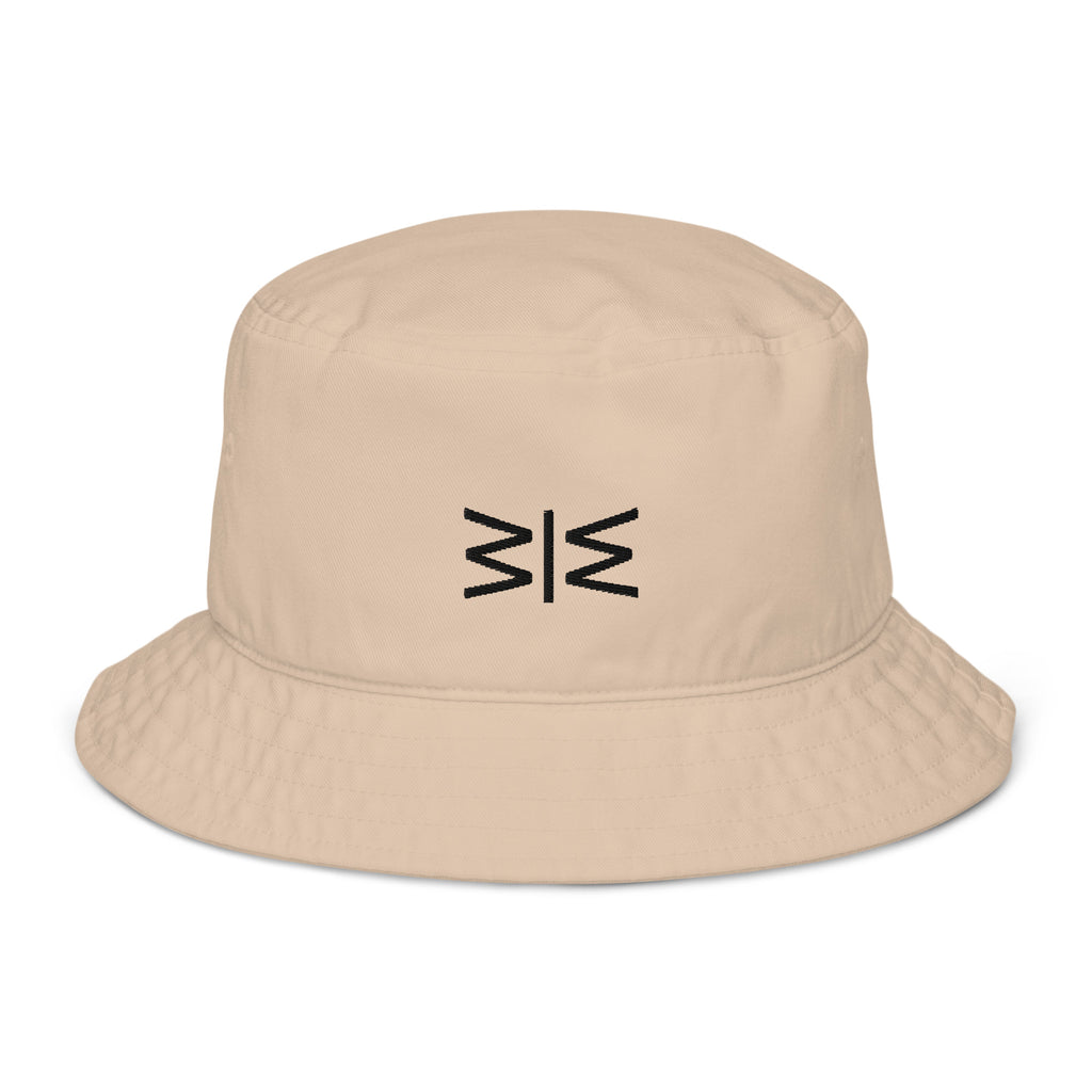 A beige bucket hat with a black embroidered geometric logo on the front, displayed against a clean white background.