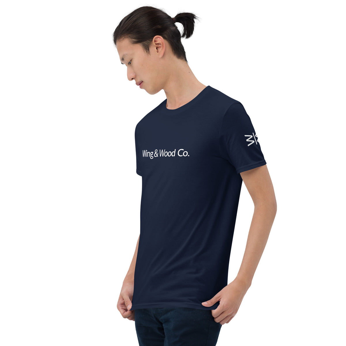 Person wearing a navy blue t-shirt with red text on a white background