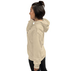 Woman wearing a beige hoodie on a white background