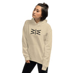 A woman wearing a beige pullover hoodie with a 'AFRICA' graphic box logo on the chest, featuring a red, green, and black patterned background with white text. She is posing against a solid white background.