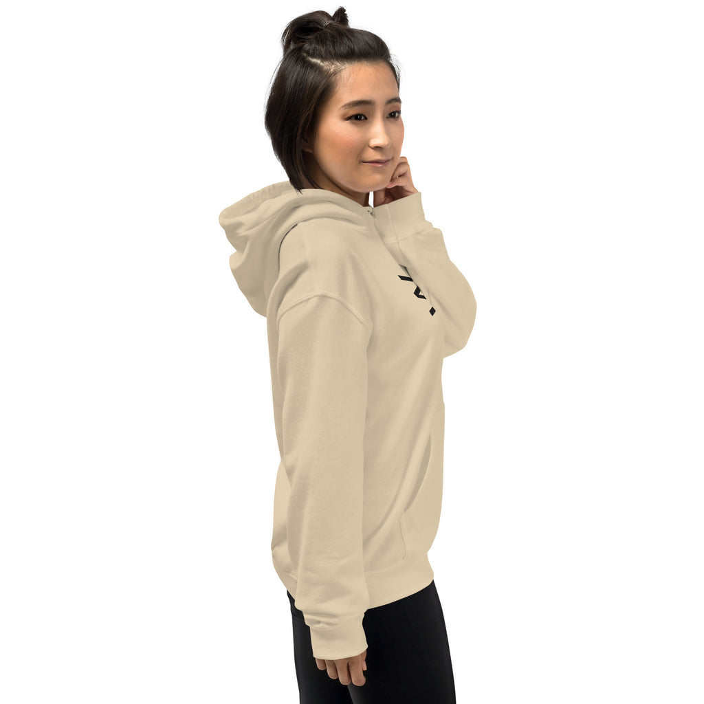 Woman wearing a beige hoodie with a logo on a white background