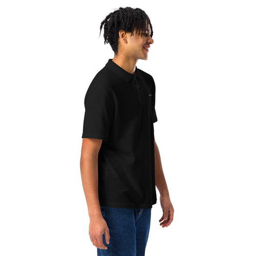 Person wearing a black polo shirt on a white background