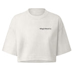 An off-white cropped short-sleeve t-shirt with 'Wing & Wood Co.' printed in black text on the left chest, displayed on a solid white background.