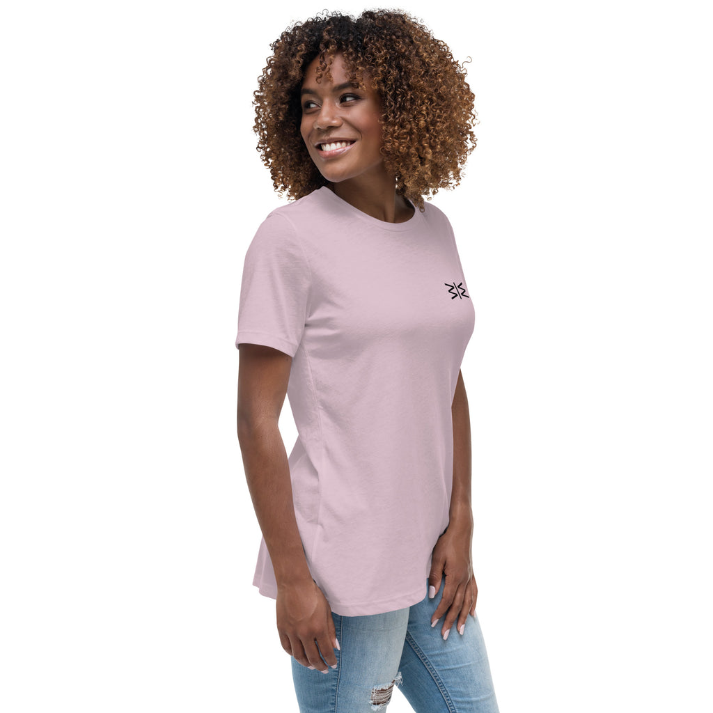 Woman wearing a light pink t-shirt with text on a white background