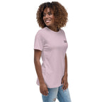 Woman wearing a light pink t-shirt with text on a white background