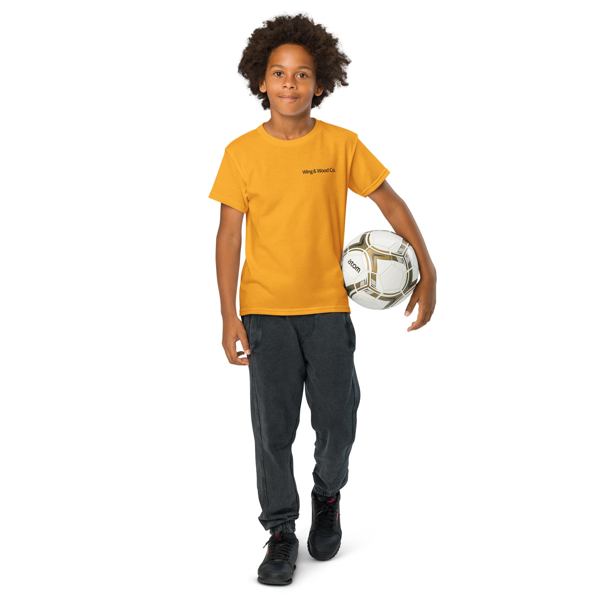 Child holding a soccer ball against a white background